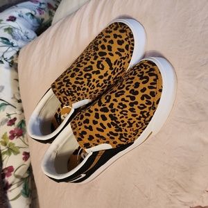 Nike cheetah print slip-ons.